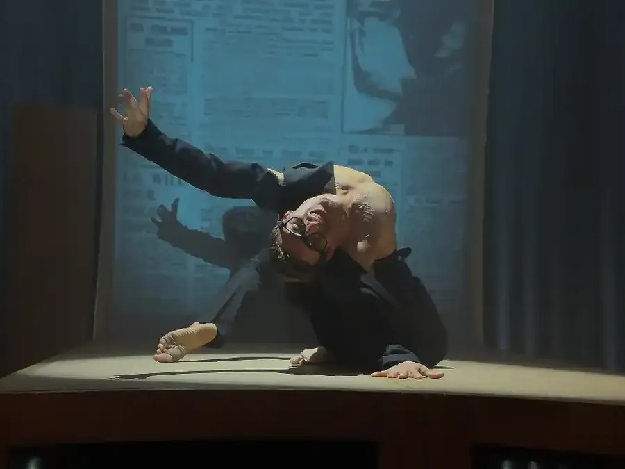 A soloist on a lit stage